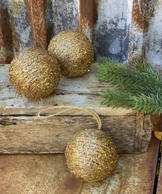 Julgranskula / dekorations kula i guld med glitter. i flätad lindad modell som är glitter klädd. Snöre upptill så man kan hänga 