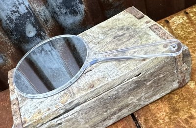Dubbelsidig spegel med handtag