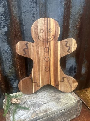 Skärbräda i trä formad som en pepparkaksgubbe 