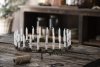 Ljusstake i rost, rund modell som står på fyra fötter med hållare för 24st ljus. Ljusstaken är för mindre ljus så kallade julgra