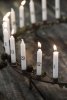 Ljusstake i rost, rund modell som står på fyra fötter med hållare för 24st ljus. Ljusstaken är för mindre ljus så kallade julgra