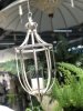 Torun hängande vit lykta med cylinderglas i klart glas. Finns i två storlekar -Större -Mindre Hänger i kedja med krok upptill. P