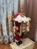 Stor fin tomte med pälskappa och julklappssäck
