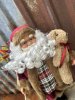 Stor fin tomte med pälskappa och julklappssäck
