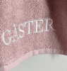Rosa GÄSTER handduk med broderad text