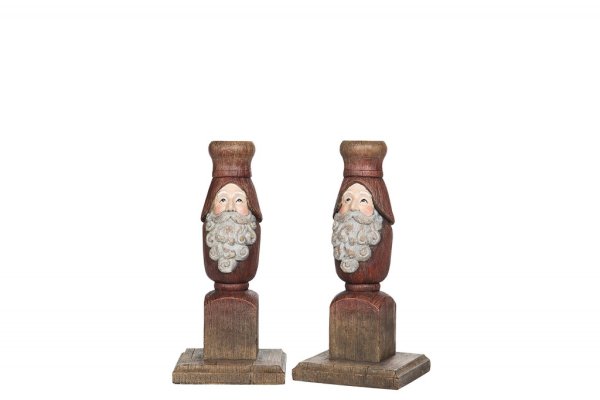Vacker ljusstake med tomte i gammeldags modell. Går i mjuka nyanser av rött, vitt och natur. Finns i tre storlekar -Högre -Mella