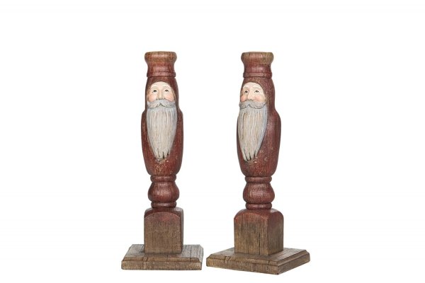 Vacker ljusstake med tomte i gammeldags modell. Går i mjuka nyanser av rött, vitt och natur. Finns i tre storlekar -Högre -Mella