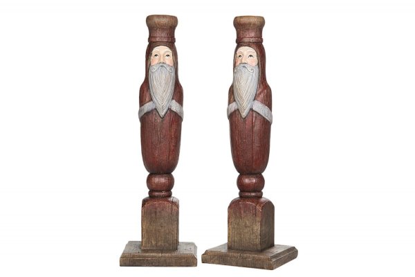 Vacker ljusstake med tomte i gammeldags modell. Går i mjuka nyanser av rött, vitt och natur. Finns i tre storlekar -Högre -Mella