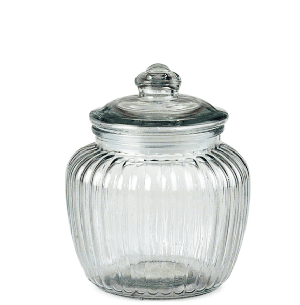 Lantlig glasburk med lock. Med diskret randigt mönster och plast tätning i locket. Av kraftigt glas. Passande till förvaring i b