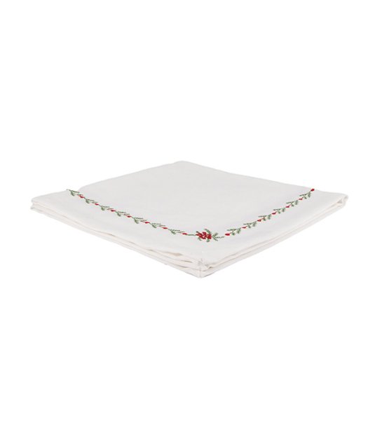 Vit duk med broderat mönster