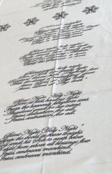 Vit Vaxduk med svart text