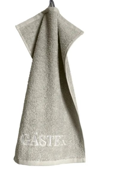 Beige GÄSTER handduk med broderad text