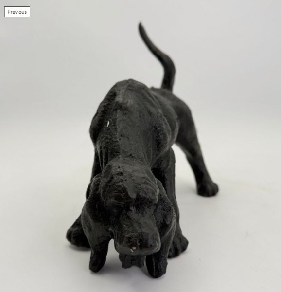 Hund i järn att dekorera med eller att ha som dörrstopp