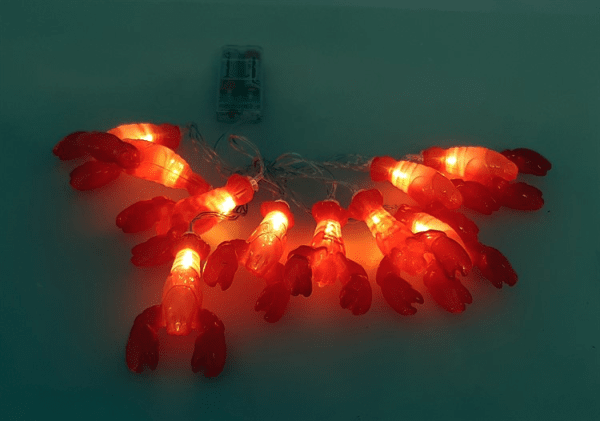 Ljusslinga girlang med kräftor i belysning 