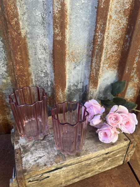 Ljuslykta till lika vas i rosa glas