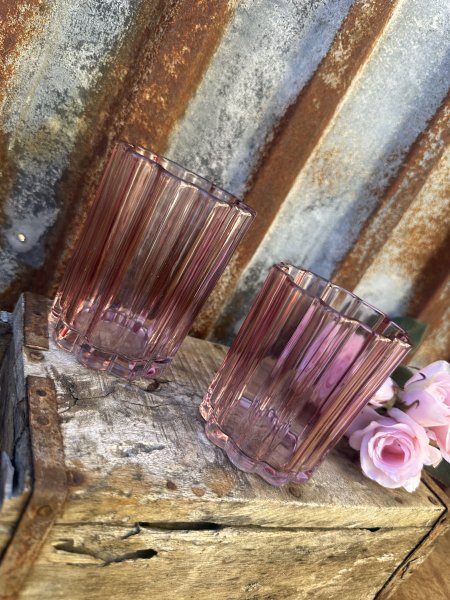 Ljuslykta till lika vas i rosa glas