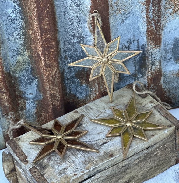 Vacker stjärna i glas och guld 