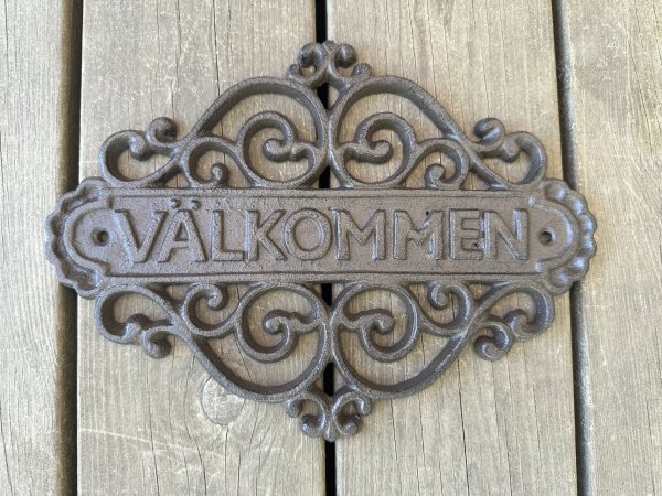 VÄLKOMMEN skylt i gjutjärn 