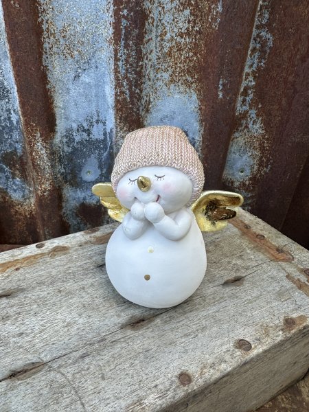 Vit stor snögubbe med guld vingar