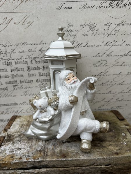 Vacker och elegant vit tomte med önskelista och belysning