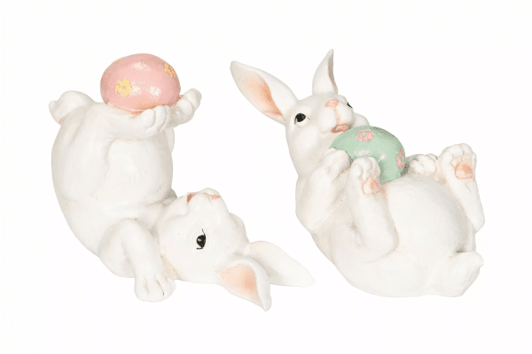 Vit kanin med pastell ägg 