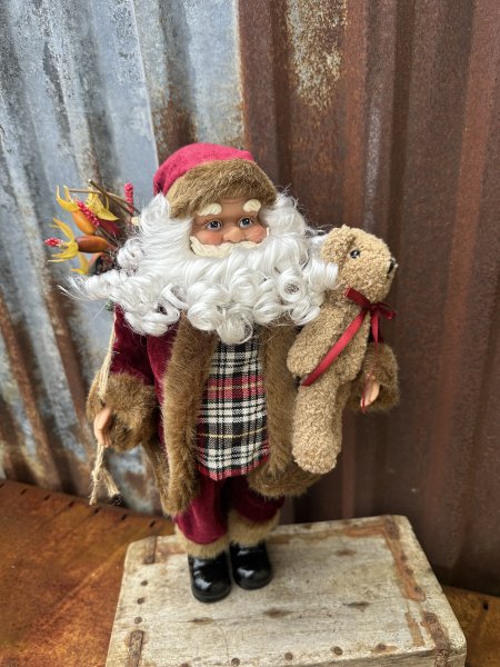 Stor fin tomte med pälskappa och julklappssäck