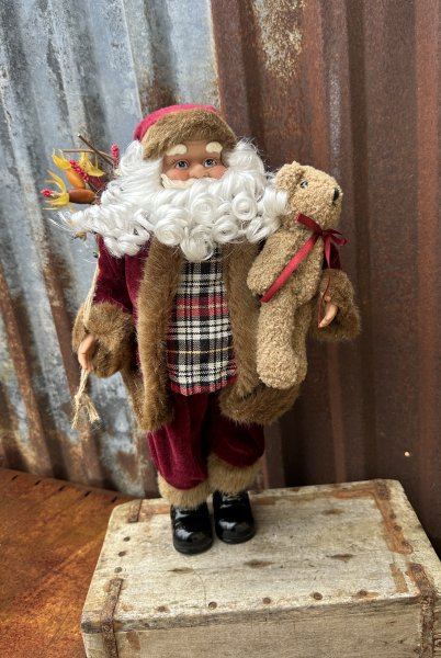 Stor fin tomte med pälskappa och julklappssäck