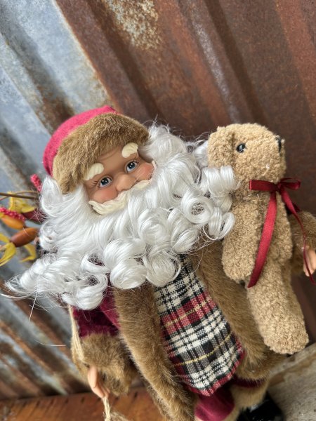 Stor fin tomte med pälskappa och julklappssäck