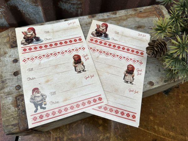 Juletikett till julklappar med tomtefar och tomtemor