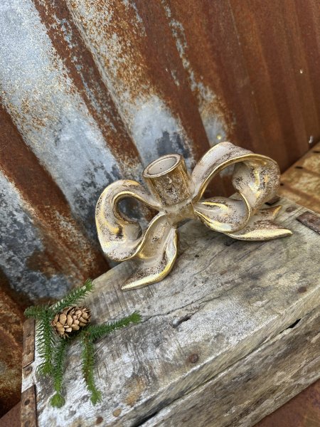 Större stående rosett ljusstake i guld nyans 