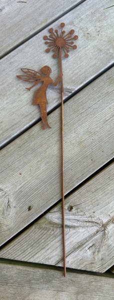 Rostig älva med maskros blomma 