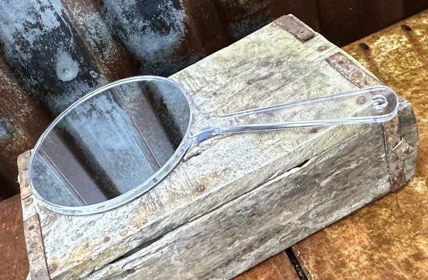 Dubbelsidig spegel med handtag