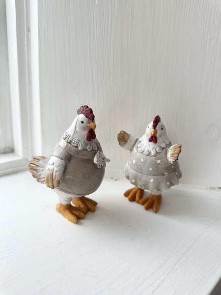 Lantlig tupp och höna att dekorera med 