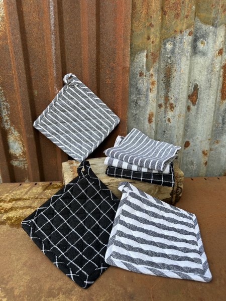 Kökshandduk och grytlapp svarta och vita nyanser 